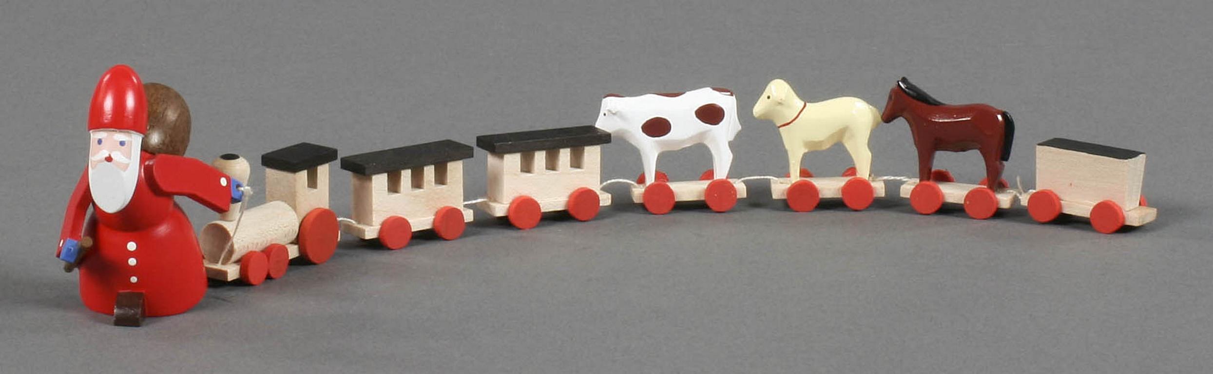 Ruprecht mit Eisenbahn und Spielzeugtieren Ruprecht mit Eisenbahn und Spielzeugtieren