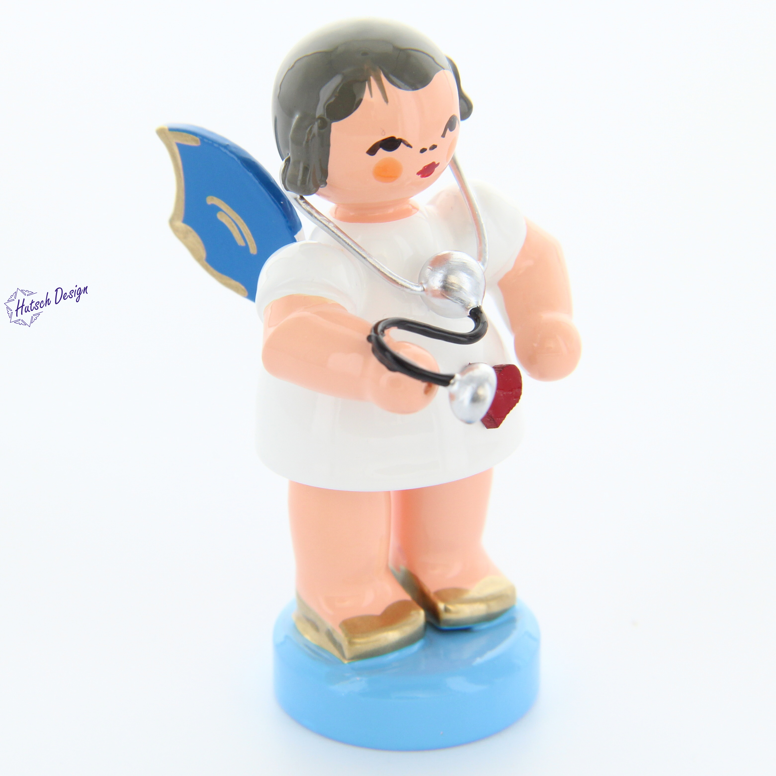 Herzengel stehend mit Stethoskop, blaue Flügel Herzengel stehend mit Stethoskop, blaue Flügel