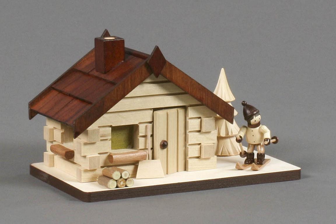Räucherhaus mit Skifahrer