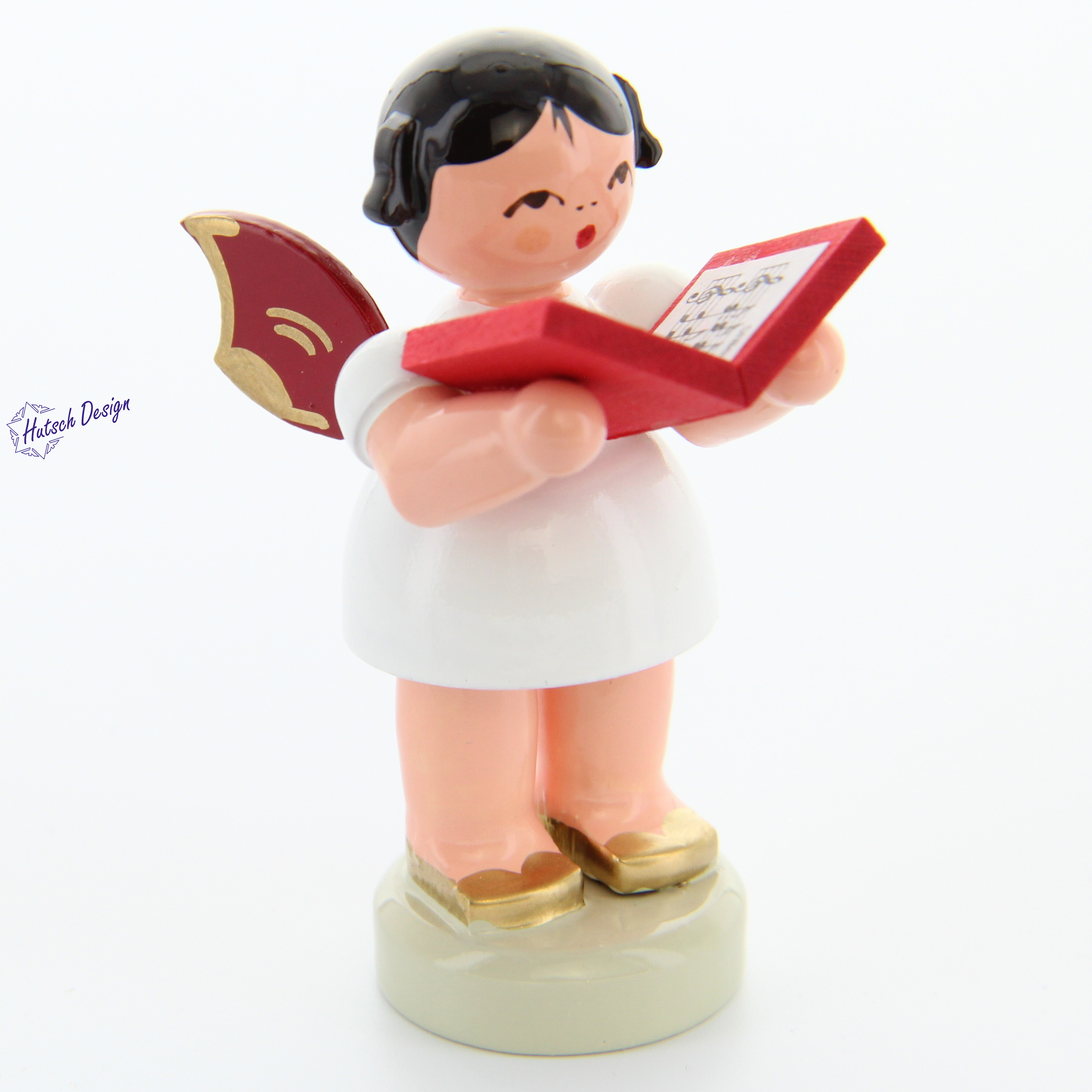 Engel stehend mit Buch, rote Flügel