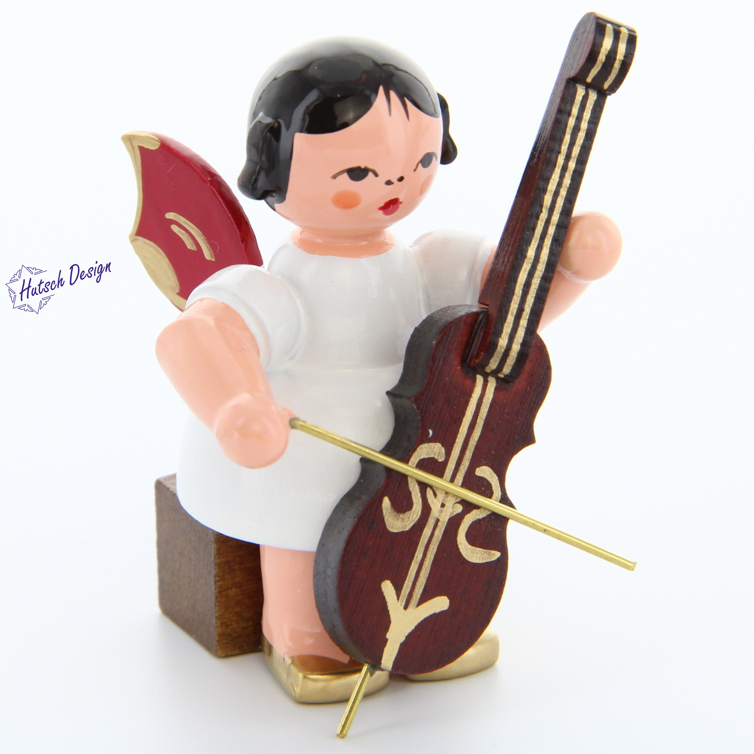 Engel sitzend mit Cello, rote Flügel