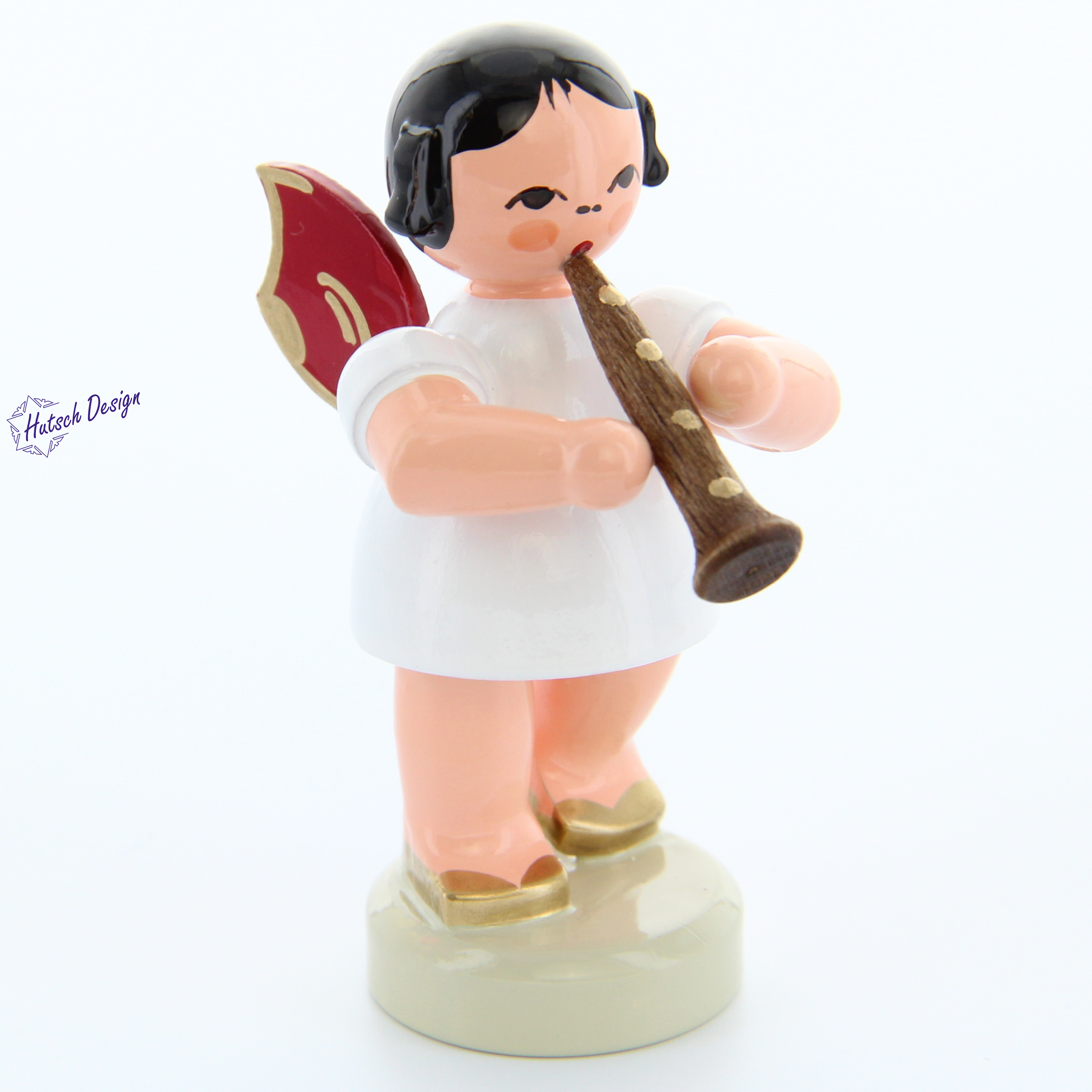Engel stehend mit Klarinette, rote Flügel