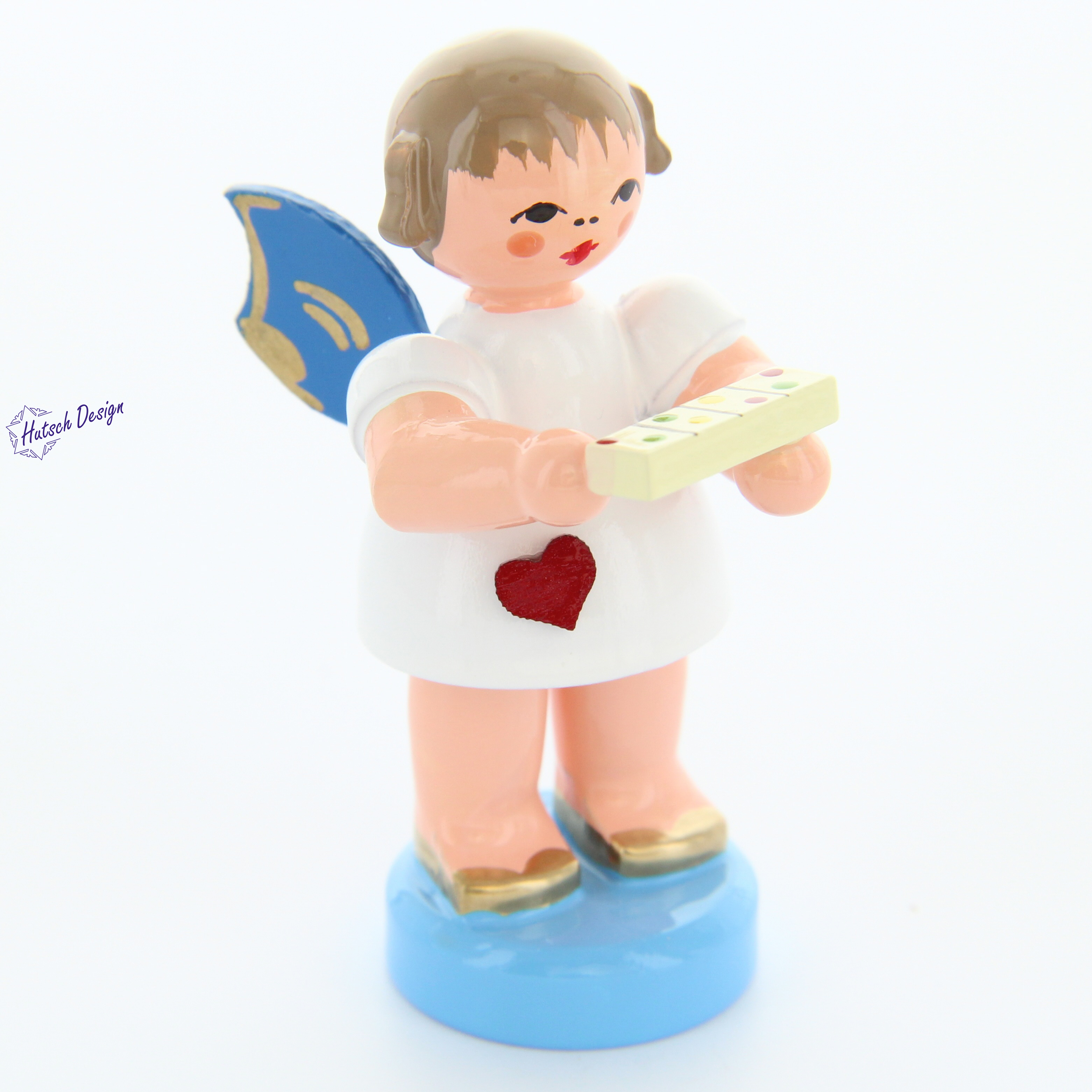 Herzengel stehend mit Tablettenbox, blaue Flügel
