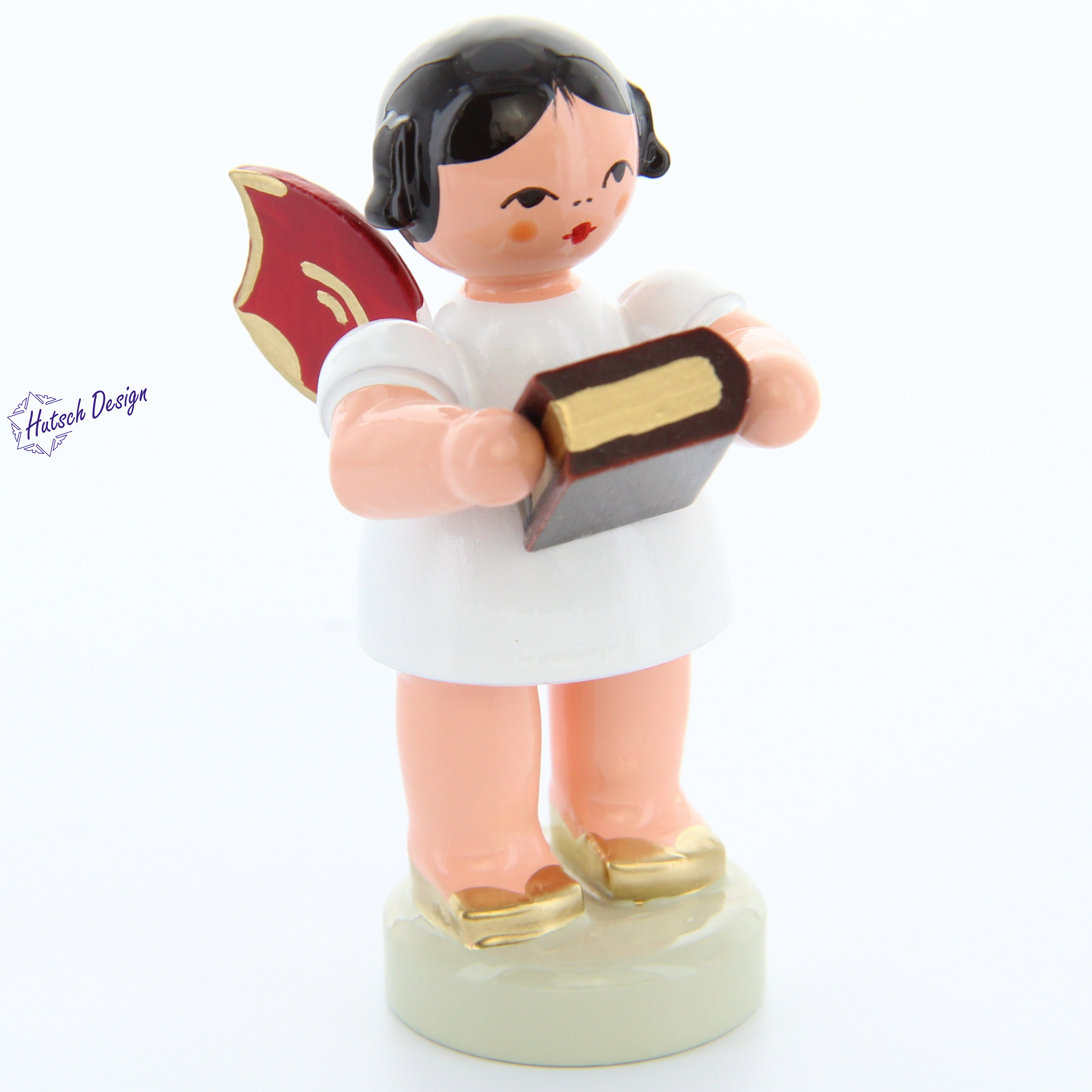 Engel stehend mit Bibel, rote Flügel