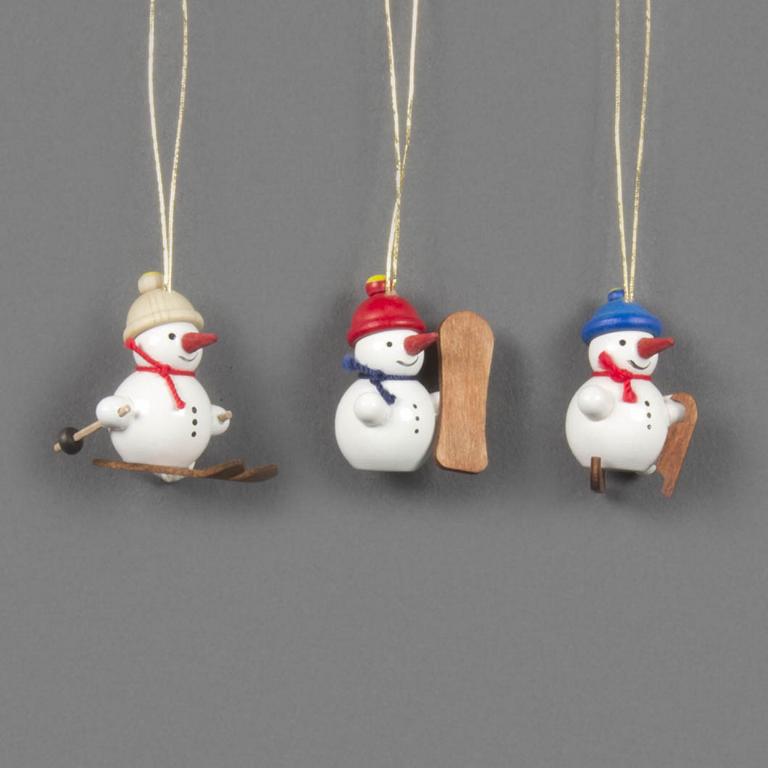 Behang Schneemanntrio Wintersportler