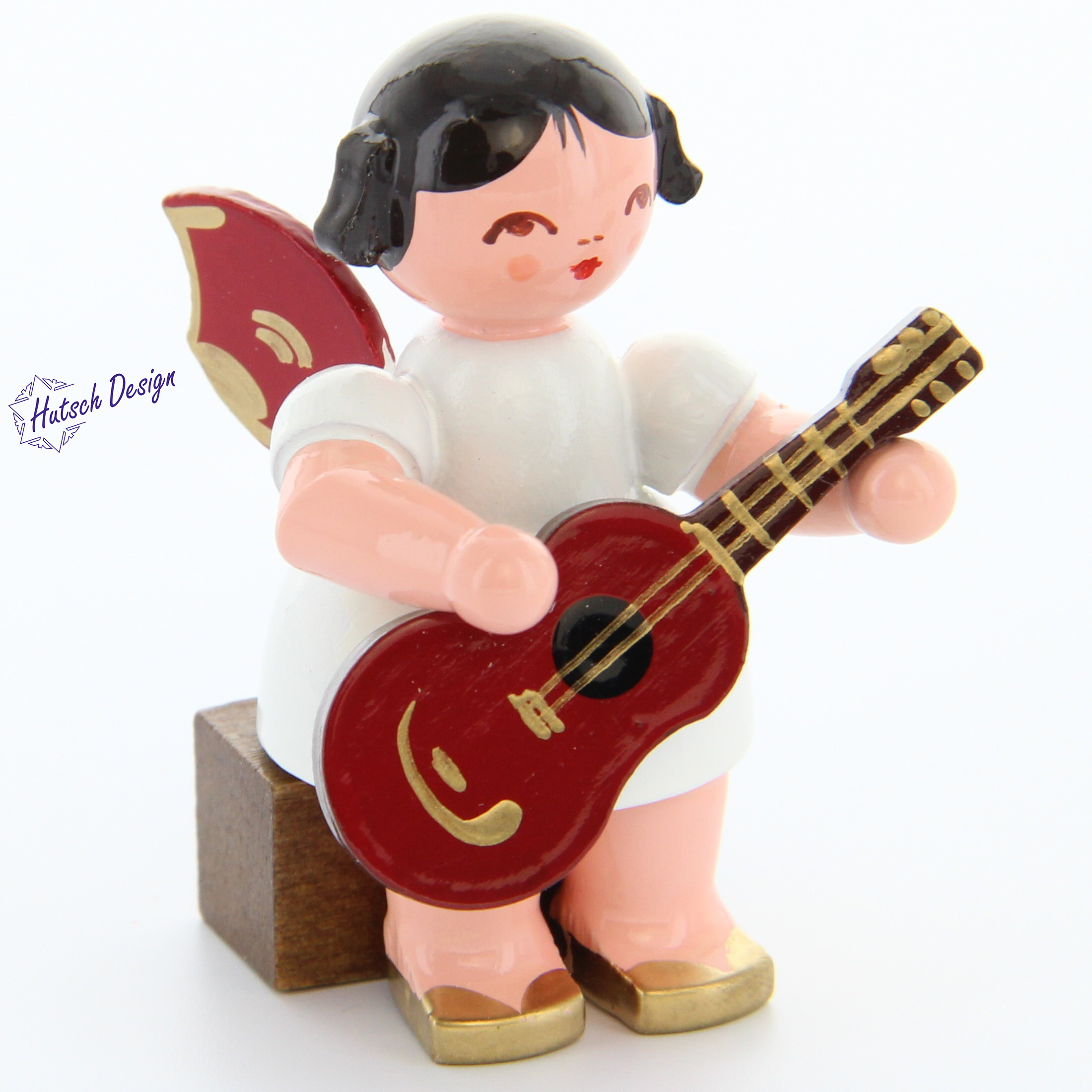 Engel sitzend mit Gitarre, rote Flügel