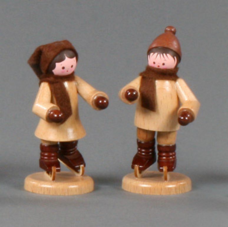 Schlittschuhkinderpaar natur