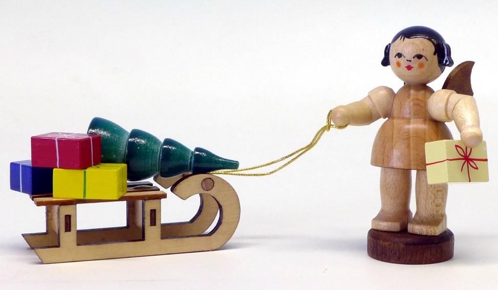 Engel stehend mit Geschenkeschlitten, blaue Flügel